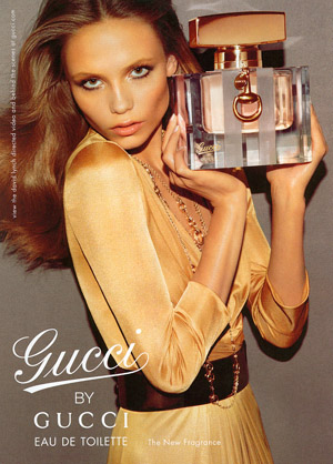 The advertisement for Gucci perfume features a very thin runway model who 